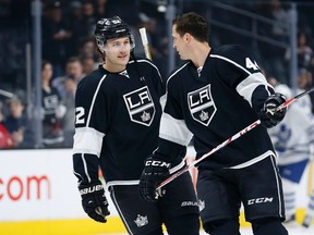 Los Angeles defenceman Luke Schenn, left, and centre Vincent Lecavalier talk as players warm up for a game against the Toronto Maple Leafs, Thursday, Jan. 7, 2016, in Los Angeles. (AP Photo/Danny Moloshok)