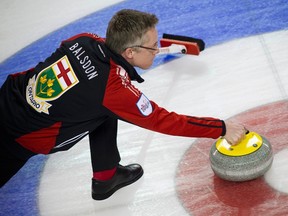 Team Ontario skip Greg Balsdon delivers a rock during the 2014 Tim Hortons Brier in Kamloops, B.C. Balsdon and his Cataraqui rink will play in the Ontario Tankard in Brantford next week. (Reuters file photo)