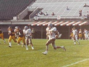 Sudbury's Mike Fabiili runs back an interception for the Ottawa Gee-Gees during a game against Concordia in 1982. Fabiili will be inducted into the university's football hall of fame in the spring.