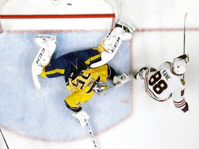 Chicago Blackhawks right winger Patrick Kane scores a goal against Nashville Predators goalie Pekka Rinne in a game in Nashville on Jan. 19, 2016. (AP Photo/Mark Humphrey)