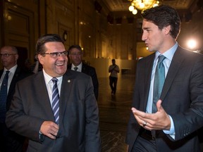 Liberal Leader Justin Trudeau chats with Montreal Mayor Denis Coderre as he arrives at Montreal City Hall, Thursday, September 3, 2015 in Montreal. THE CANADIAN PRESS/Paul Chiasson