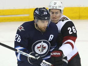 Winnipeg Jets right winger Blake Wheeler (l) and Arizona Coyotes defenceman Michael Stone tangle during NHL hockey in Winnipeg, Man. Tuesday January 26, 2016.
Brian Donogh/Winnipeg Sun/Postmedia Network