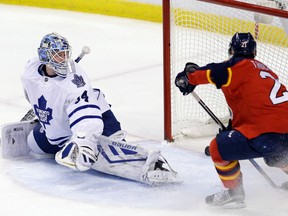 Florida Panthers centre Vincent Trocheck scores on Toronto Maple Leafs goalie James Reimer (34) Tuesday, Jan. 26, 2016, in Sunrise, Fla. (AP Photo/Alan Diaz)