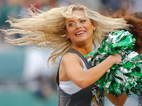 New York Jets cheerleader performs during the first half of game against the New England Patriots at MetLife Stadium. Jim O'Connor-USA TODAY Sports