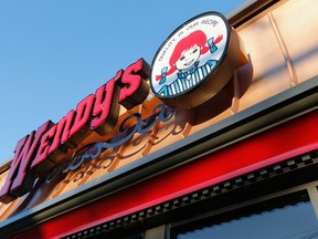 This Friday, March 21, 2014, file photo, shows a Wendy's restaurant in Providence, R.I. Wendy’s says it is investigating reports of “unusual activity” on payment cards that had been used at some of its restaurants. (AP Photo/Michael Dwyer, File)