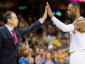 David Blatt celebrates with LeBron James of the Cleveland Cavaliers during the second half at Quicken Loans Arena in Cleveland on Nov. 8, 2015. (Jason Miller/Getty Images/AFP)
