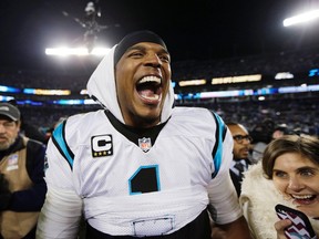 Carolina Panthers' Cam Newton celebrates after the NFL football NFC Championship game against the Arizona Cardinals, Sunday, Jan. 24, 2016, in Charlotte, N.C. The Panthers won 49-15 to advance to the Super Bowl. (AP Photo/Chuck Burton)