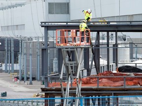 Workers assemble a new building at the Darlington nuclear facility in Courtice, Ont. on Thursday, October 30, 2014. (THE CANADIAN PRESS/Frank Gunn)