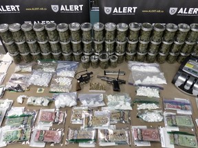 Guns, drugs and cash were among the things seized in a Jan. 21, 2016, Grande Prairie bust. (SUPPLIED)