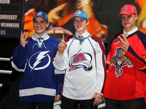 Jonathan Drouin (Tampa Bay), Nathan MacKinnon (Colorado) and Aleksander Barkov (Florida) pose as the top three draft picks during the NHL draft at the Prudential Center in Newark, N.J., on June 30, 2013. (Andre Forget/Postmedia Network)
