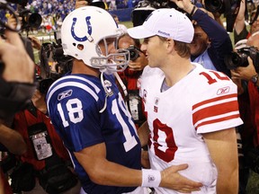 Indianapolis Colts quarterback Peyton Manning (18) greets his brother, New York Giants quarterback Eli Manning after their NFL football game in Indianapolis September 19, 2010.   REUTERS/Brent Smith