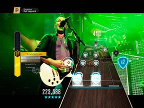 This image provided by Activision Publishing Inc. shows Def Leppard performing "Dangerous," in a scene from the video game, "Guitar Hero Live."   (Activision Publishing Inc. via AP)