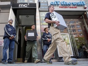 Law enforcement officers seize evidence from the Manhattan offices of Rentboy.com in New York August 25, 2015. (REUTERS/Brendan McDermid)