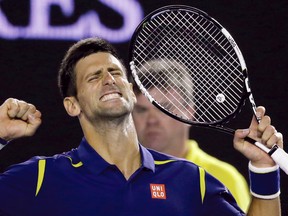 Novak Djokovic of Serbia celebrates after defeating Roger Federer of Switzerland in their semifinal match at the Australian Open tennis championships in Melbourne, Australia, Thursday, Jan. 28, 2016.(AP Photo/Aaron Favila)