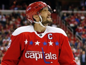 Washington Capitals left wing Alex Ovechkin (8) looks at the scoreboard against the Philadelphia Flyers in the third period at Verizon Center. The Flyers won 4-3 in overtime. Geoff Burke-USA TODAY Sports