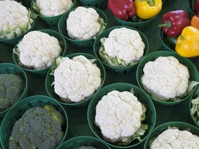 Cauliflowers, surrounded by broccoli and peppers, are seen at the Jean Talon Market in Montreal, on Jan. 11, 2016. (THE CANADIAN PRESS/Paul Chiasson)