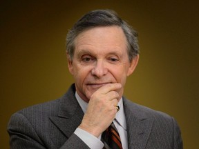 Communications Security Establishment Commissioner Jean-Pierre Plouffe waits to appear before the Senate national security committee on the Anti-terrorism act, Bill C-51, Thursday, April 23, 2015 in Ottawa. A federal watchdog says Canada's electronic spy agency broke privacy laws by sharing information about Canadians with foreign partners. (THE CANADIAN PRESS/Adrian Wyld)