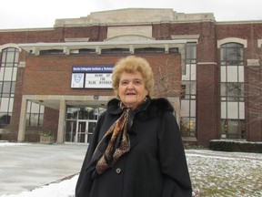 Allison Rowell stands on Wednesday January 27, 2016 in Sarnia, Ont., in front of Sarnia Collegiate Institute and Technical School. As a student in the 1950s, Rowell wrote The SCITS Song. (Paul Morden, The Observer)