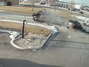 A pickup truck careened into three cars and burst into flames Saturday afternoon in Windsor, Ont. (video screengrab)