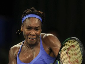 Venus Williams returns a ball during her semi-final match against Roberta Vinci at the WTA Elite Trophy tennis tournament in Zhuhai, China, on Nov. 7, 2015. (Color China Photo via AP)