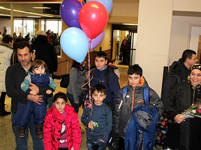 The first Syrian refugee family sponsored by the Chatham-Kent community arrive at the Windsor International Airport on Dec. 21, 2015. Ellwood Shreve/Chatham Daily News/Postmedia Network
