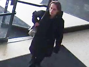 Kingston Police are searching for a woman who smashed a Hock Shop front window at the Frontenac Mall in Kingston, Ont. on Tuesday January 19, 2016. Supplied Photo