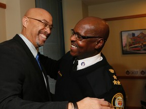 Toronto Police Chief Mark Saunders, on a day when four of his officers were charged with obstruction, helps celebrate the retirement of Const. Donny Moss on Thursday, January 28, 2016. (Stan Behal/Toronto Sun)