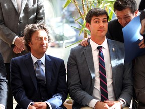 Daryl Katz, left, and Mayor Don Iveson watch as the new Katz building is unveiled at Stantec in 2014. (File)