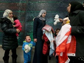 Families from Syria arrive at the Ottawa airport in late December. (JULIE OLIVER)