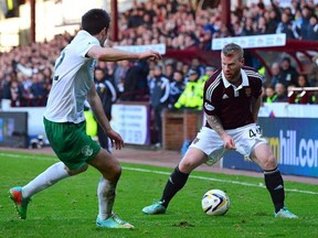 Adam Eckersley of Hearts, right, takes on Callum Booth of Hibernian during the Scottish Championship final on January 3, 2015, in Edinburgh Scotland. Eckersley signed with FC Edmonton on Thursday. (Mark Runnacles/Getty Images)