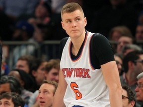 Kristaps Porzingis of the New York Knicks takes a break Jan. 26, 2016, during his team’s overtime loss to Oklahoma City. Porzingis did not play on Jan. 28, 2016, against the Raptors. (BRAD PENNER/USA Today Sports)