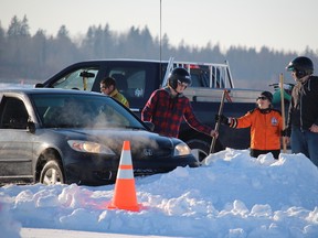 On Roy’s Lake in Parkland County, new ice racers weaved around pilons (and shovelled themselves out of the snow) at driving school on Jan. 23 before a jam-packed schedule of racing the following day. - photo by Mitch Goldenberg