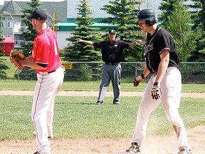 Umpire Brandon Strocki calls the runner safe at a Senior AAA Whitesox game in 2014. The Stony Plain native won Baseball Alberta’s Umpire of the Year award in 2015, and hopes to move on to calling international games in the future. - File Photo