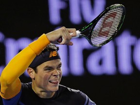 Milos Raonic of Canada plays a forehand return to Andy Murray of Britain during their semifinal match at the Australian Open tennis championships in Melbourne, Australia on Jan. 29, 2016. (AP Photo/Aaron Favila)
