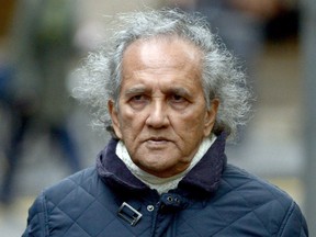 Maoist cult leader Aravindan Balakrishnan arrives at  Southwark Crown Court in London, in this Nov. 30, 2015 file photo. Balakrishnan  was sentenced to 23 years in prison, on Jan. 29, 2016, for raping and sexually assaulting his female followers and keeping his daughter a prisoner in a secretive Maoist commune for three decades. (Anthony Devlin/PA, File via AP)