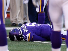 In this Nov. 8, 2015, file photo, Minnesota Vikings quarterback Teddy Bridgewater lies on the field after a hit during the second half of an NFL football game against the St. Louis Rams, in Minneapolis. (AP Photo/Ann Heisenfelt, File)