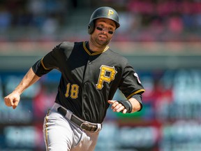 In this Wednesday, July 29, 2015 file photo, Pittsburgh Pirates second baseman Neil Walker scores against the Minnesota Twins in Minneapolis. (AP Photo/Bruce Kluckhohn, File)