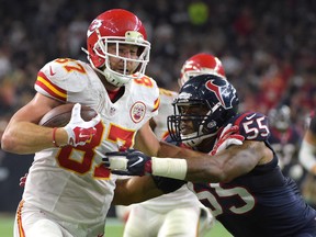 Kansas City Chiefs tight end Travis Kelce (87) is pushed out of bounds by Houston Texans linebacker Benardrick McKinney in a AFC Wild Card playoff game at NRG Stadium. (Kirby Lee/USA TODAY Sports)