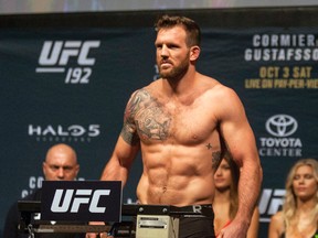 UFC fighter Ryan Bader stands during the weigh-in for UFC 192 in Houston on Oct. 2, 2015. (AP Photo/Juan DeLeon)