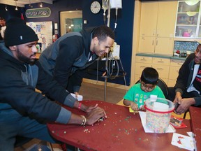 The Toronto Raptors help Athavan Antonr, 8, with his project during their annual visit to the Hospital for Sick Children on Friday January 29, 2016, in Toronto. Veronica Henri/Toronto Sun/Postmedia Network