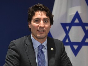 Canadian Prime Minister Justin Trudeau makes opening remarks at the start of a bilateral meeting with Israel at the United Nations climate change summit Monday, November 30, 2015 in Le Bourget, France. THE CANADIAN PRESS/Adrian Wyld