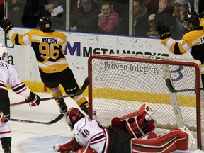 Kingston Frontenacs Spencer Watson scores  his 100th Ontario Hockey League goal  Owen Sound Attack's Michael McNiven during action at the Rogers K-Rock Centre in Kingston on Friday. (Ian MacAlpine/The Whig-Standard)