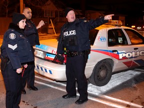 Toronto police on scene of a deadly shooting in the Playfair Ave. and Caledonia Rd. area of North York. (Craig Robertson/Toronto Sun/Postmedia Network)