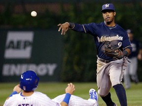 The Milwaukee Brewers have traded shortstop Jean Segura, right, and righty Tyler Wagner to the Arizona Diamondbacks for right-handed starter Chase Anderson and infielder Aaron Hill. The Brewers also got minor league shortstop Isan Diaz and cash in the deal announced Saturday, Jan. 30, 2016. (AP Photo/Nam Y. Huh, File)