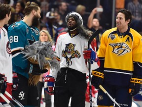 Dressed as Panthers' Jaromir Jagr, Montreal Canadiens defenceman P.K. Subban (68) celebrates with Brent Burns of the San Jose Sharks, who holds his Chewbacca mask, after winning the breakaway challenge competition during the 2016 NHL All Star Game Skills Competition at Bridgestone Arena on Jan 30, 2016 in Nashville, TN. (Christopher Hanewinckel-USA TODAY Sports)