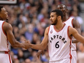 Toronto Raptors' Kyle Lowry (7) and Cory Joseph celebrate after scoring against the Detroit Pistons during second half NBA basketball action in Toronto on Saturday, Jan. 30, 2016. The Raptors went on to record the team's 11th-straight win. (THE CANADIAN PRESS/Frank Gunn)