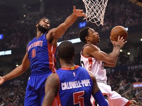 Raptors’ DeMar DeRozan drives to the basket as Detroit Pistons’ Andre Drummond defends during the first half at the Air Canada Centre. DeRozan led the Raptors with 29 points. (Fran Gunn/THE CANADIAN PRESS)