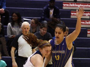 Laurentian's Nicole Eccles (13) defends against Toronto's Sarah Bennett (12) during OUA women's basketball action in the Ben Avery Gym on Saturday. Ben Leeson/The Sudbury Star/Postmedia Network