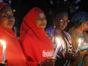 Members of the Bring Back Our Girls (BBOG) movement attend a candlelight procession in tribute to military personnel who were killed in the fight against Boko Haram militants, during Nigeria's Armed Forces Remembrance Day in Abuja, Nigeria January 15, 2016. REUTERS/Afolabi Sotunde