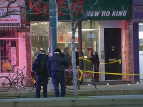 Toronto Police at the scene of a fatal shooting on Spadina Ave. early Sunday, Jan. 31, 2016. (Andrew Collins photo)